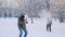 Young Couple is Playing Snowball Fight