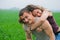 Young couple playing in a wheat field