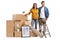 Young couple posing with a pile of packed cardboard boxes for home removal