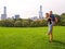 A young couple posing at Sheep Meadow in Central Park, NY, New York