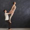 Young couple practicing acroyoga on mat together