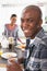 Young Couple Preparing Breakfast In Modern Kitchen