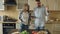Young couple quarrels in the kitchen at home