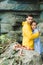 young couple in raincoats terrified of snake lying