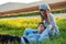 Young couple relaxing in green grass field.