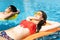 Young couple relaxing on inflatable raft