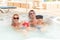 Young couple relaxing in jacuzzi pool