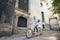 Young couple on retro tandem bicycle at the street city