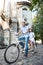 Young couple on retro tandem bicycle at the street city