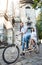 Young couple on retro tandem bicycle at the street city