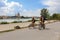 A young couple riding bicycles on the Danube island. Vienna, Austria