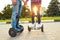 A young couple riding hoverboard - electrical scooter, personal