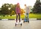 Young couple riding hoverboard - electrical scooter, personal ec