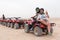 Young couple riding sand ATV