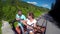 Young couple on the road in a jeep with an open top in the mountains. The guy and the girl are traveling on a pickup