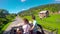 Young couple on the road in a jeep with an open top in the mountains. The guy and the girl are traveling on a pickup