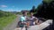 Young couple on the road in a jeep with an open top in the mountains. The guy and the girl are traveling on a pickup