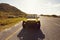 Young couple on road trip in beach buggy