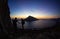 Young couple of rock climbers at sunset