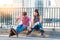 Young couple on rollerblades sitting.