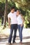 Young Couple On Romantic Walk In Countryside