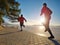 Young couple of runners during regular workout