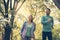 Young couple running together in park. Young people exercising.