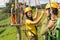 Young couple in safety equipment adventure park