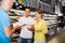 Young couple and sales assistant at shop