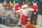 Young couple with Santa celebrating New Year 2017, Christmas