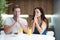 Young couple saying prayer before start eating their breakfast in the kitchen family traditions