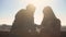 Young couple scrolling phones on rooftop, navigation for tourists, geolocation