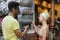 Young Couple On Shopping Choosing Bag, Man And Woman Happy Smiling In Retail Store