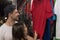 Young Couple On Shopping Choosing Clothes, Man And Woman Buyers Happy Smiling In Retail Store