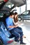 young couple in the showroom of a car dealership buying and testing vehicles