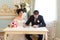 Young couple signing wedding contract