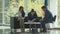 Young couple signs documents in a stylish office