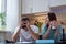 A young couple sits at a table in the kitchen and analyzes the family budget. The financial crisis in the family.