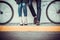 Young couple sitting on a bicycle opposite the city