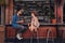 Young couple sitting at cafe counter