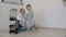 Young couple sitting on the floor at home