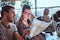 A young couple sitting in an outdoor caf planning to itinerary their journey