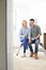 Young Couple Sitting In Property Being Renovated