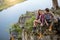 Young couple sitting on a rock having a conversation