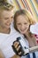 Young couple sitting on sofa looking at video camera screen close up