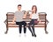 Young couple sitting together on street bench and talking. Happy man and woman in love isolated on white background. Boy