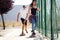 Young couple skateboarding in the street.