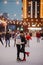 Young couple skates at the rink and kisses