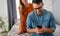 Young couple with smartphone having quarell and marriage conflict because of cheating