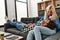 Young couple smling happy sitting on the sofa at home